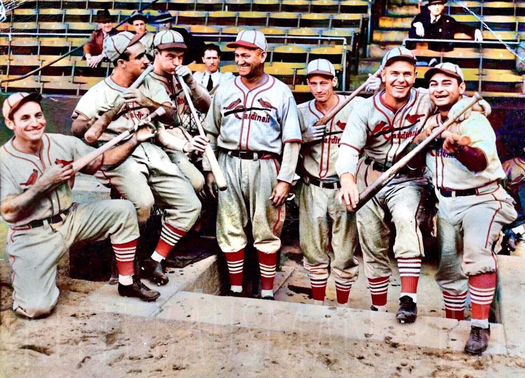 The Mudcat band of Gashouse Cardinals pretending to use their bats as instruments in front of the Dugout 