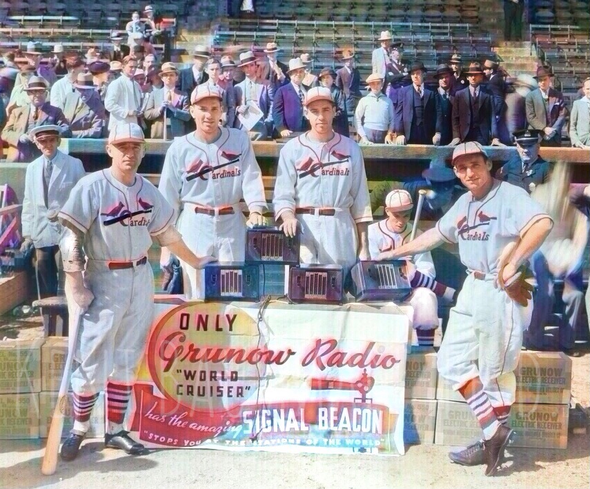 From left to right Frank Frisch, Dizzy Dean, Paul Dean and Pepper Martin in front of a set of radios and and radio banner